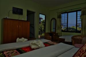 Una cama o camas en una habitación de Hotel Mandala