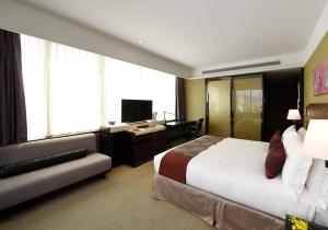 Postel nebo postele na pokoji v ubytování Fullon Hotel Taipei, Central