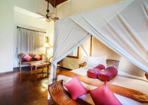 Voodi või voodid majutusasutuse Junjungan Ubud Hotel and Spa toas