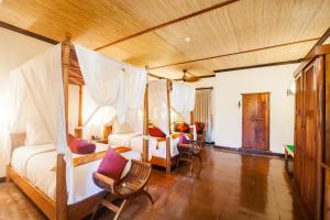 Voodi või voodid majutusasutuse Junjungan Ubud Hotel and Spa toas