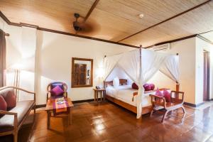 Voodi või voodid majutusasutuse Junjungan Ubud Hotel and Spa toas