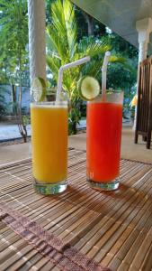two cocktails sitting on top of a table at Yala Southern Retreat in Tissamaharama +48 photos