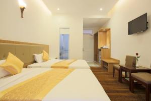 Letto o letti in una camera di Red Palace Hotel