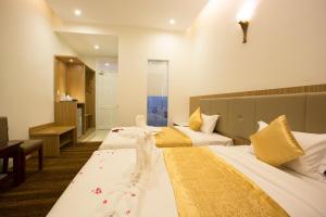 Letto o letti in una camera di Red Palace Hotel