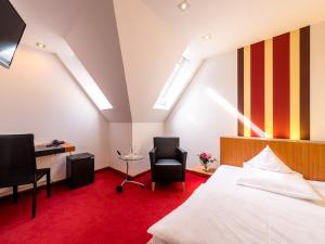 Ein Bett oder Betten in einem Zimmer der Unterkunft Hotel Antoniushütte