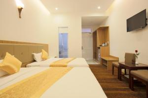 Letto o letti in una camera di Red Palace Hotel