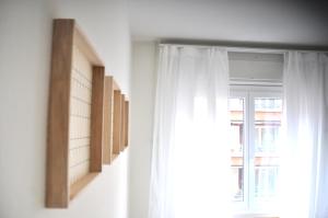 a window with white curtains in a room at Cozy Apartment Ulmenstrasse in Luzern