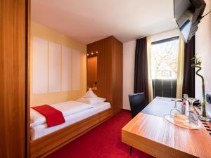 Ein Bett oder Betten in einem Zimmer der Unterkunft Hotel Antoniushütte