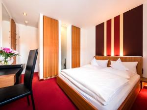 Ein Bett oder Betten in einem Zimmer der Unterkunft Hotel Antoniushütte