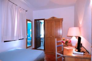 Rúm í herbergi á Boutique Hotel Sant'Andrea & Relais