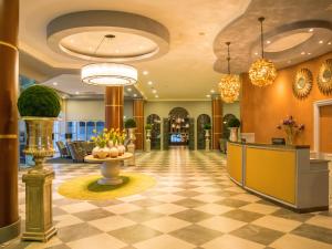 a lobby of a hotel with a checkerboard floor at Midlands Park Hotel in Portlaoise