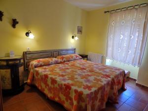 Łóżko lub łóżka w pokoju w obiekcie Casa Rural La Perra Gorda