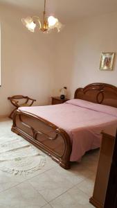 En eller flere senge i et værelse på A Casa Di Melo