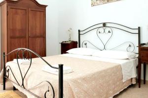 Postel nebo postele na pokoji v ubytování B&B Arcobaleno