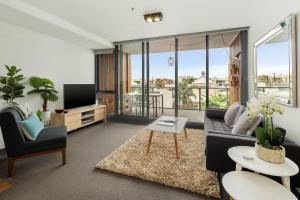 TV a/nebo společenská místnost v ubytování Beach Apartment Port Melbourne