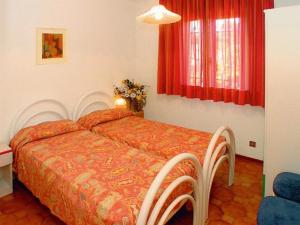 Posteľ alebo postele v izbe v ubytovaní Lignano Riviera with fireplace & air conditioning