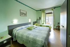 Postel nebo postele na pokoji v ubytování Albergo Mancuso del Voison