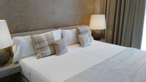 Ein Bett oder Betten in einem Zimmer der Unterkunft Cosmo Apartments Platja d'Aro