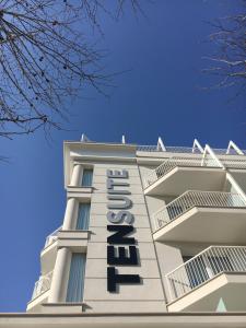 a hotel sign on the side of a building at Residence Ten Suite in Rimini