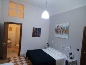 Cama o camas de una habitación en Ortigia Basic -Locazione Turistica