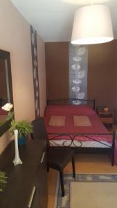 מיטה או מיטות בחדר ב-Csaba Apartment