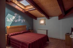 Un ou plusieurs lits dans un hébergement de l'établissement Hotel Rural El Lagar