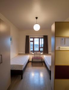 Postel nebo postele na pokoji v ubytování Student Hostel