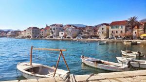 a group of boats are docked in a body of water at Apartment Anna in Kaštela