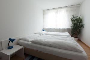 Ein Bett oder Betten in einem Zimmer der Unterkunft Hotel Alpha