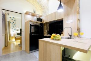 Kuchyňa alebo kuchynka v ubytovaní Dalti Center Apartment