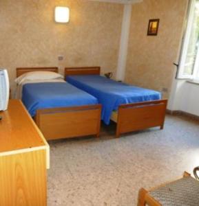 Postel nebo postele na pokoji v ubytování Hotel Bolognese