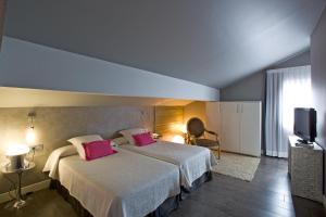 Postel nebo postele na pokoji v ubytování Hotel Castillo
