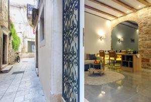two views of a living room and a dining room at Dalti Center Apartment in Zadar