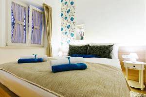 Posteľ alebo postele v izbe v ubytovaní Dalti Center Apartment