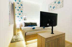 Posteľ alebo postele v izbe v ubytovaní Dalti Center Apartment