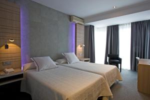 Postel nebo postele na pokoji v ubytování Hotel Castillo