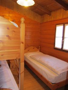 Postel nebo postele na pokoji v ubytování Camping Val di Sole