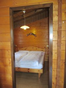 Postel nebo postele na pokoji v ubytování Camping Val di Sole