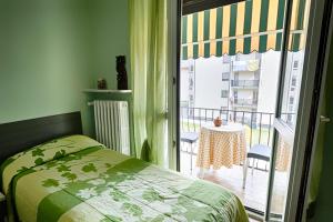 a bedroom with a bed and a window at Albergo Mancuso del Voison in Aosta