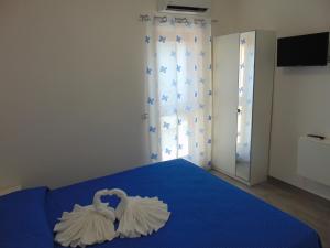 Postel nebo postele na pokoji v ubytování Vista Mare B&B