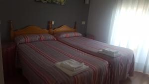 Postel nebo postele na pokoji v ubytování Hostal La Tablada