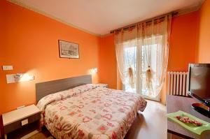Postel nebo postele na pokoji v ubytování Albergo Mancuso del Voison