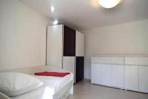 Postel nebo postele na pokoji v ubytování Aurelia Apartment + 37 fotografií