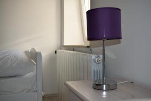 Postel nebo postele na pokoji v ubytování Aurelia Apartment