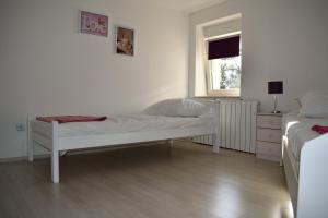 Postel nebo postele na pokoji v ubytování Aurelia Apartment