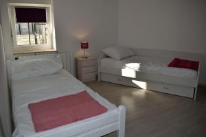 Postel nebo postele na pokoji v ubytování Aurelia Apartment