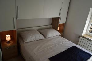 Postel nebo postele na pokoji v ubytování Aurelia Apartment