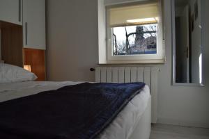 Postel nebo postele na pokoji v ubytování Aurelia Apartment