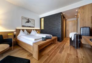 Postel nebo postele na pokoji v ubytování Waldhotel Arosa