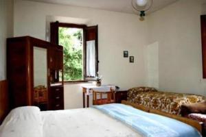 Postel nebo postele na pokoji v ubytování Albergo Ristorante Guidi